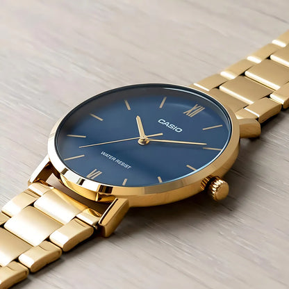Reloj Casio Acerado Clásico Dorado fondo Azul Mtp-vt01g-2budf